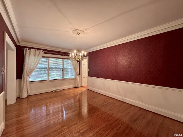 360 N Normal St, Macomb, IL 61455 - unfurnished dining area featuring a chandelier, wood finished floors, and ornamental molding