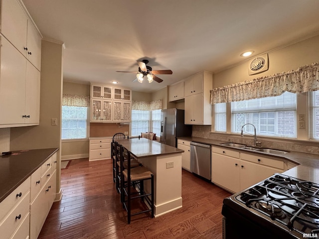 360 N Normal St, Macomb, IL 61455 - kitchen featuring appliances with stainless steel finishes, ceiling fan, white cabinets, dark wood-type flooring, and recessed lighting