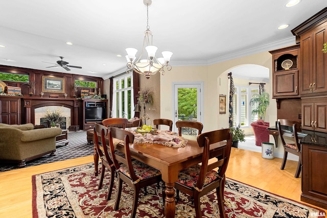11518 N Nettle Creek Dr, Dunlap, IL 61525 - dining room with arched walkways, ornamental molding, light wood-type flooring, a chandelier, and recessed lighting