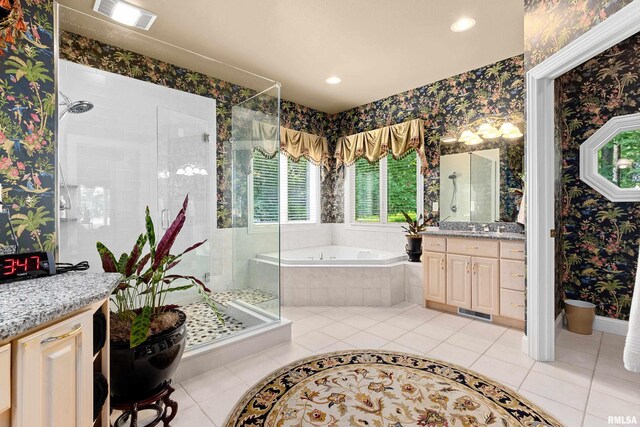 11518 N Nettle Creek Dr, Dunlap, IL 61525 - bathroom featuring a bath, a shower stall, vanity, wallpapered walls, and tile patterned floors
