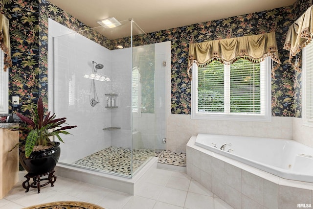 11518 N Nettle Creek Dr, Dunlap, IL 61525 - bathroom with a jetted tub, a stall shower, tile patterned flooring, and wallpapered walls