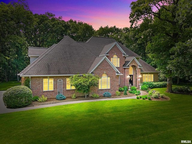 11518 N Nettle Creek Dr, Dunlap, IL 61525 - traditional-style house featuring a yard, brick siding, and a shingled roof