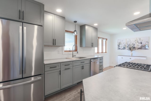 4415 N Rosemead Dr, Peoria, IL 61614 - kitchen featuring appliances with stainless steel finishes, island range hood, gray cabinets, light countertops, and wood finished floors
