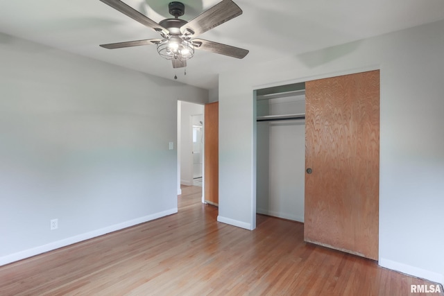4415 N Rosemead Dr, Peoria, IL 61614 - unfurnished bedroom featuring wood finished floors, a closet, and ceiling fan
