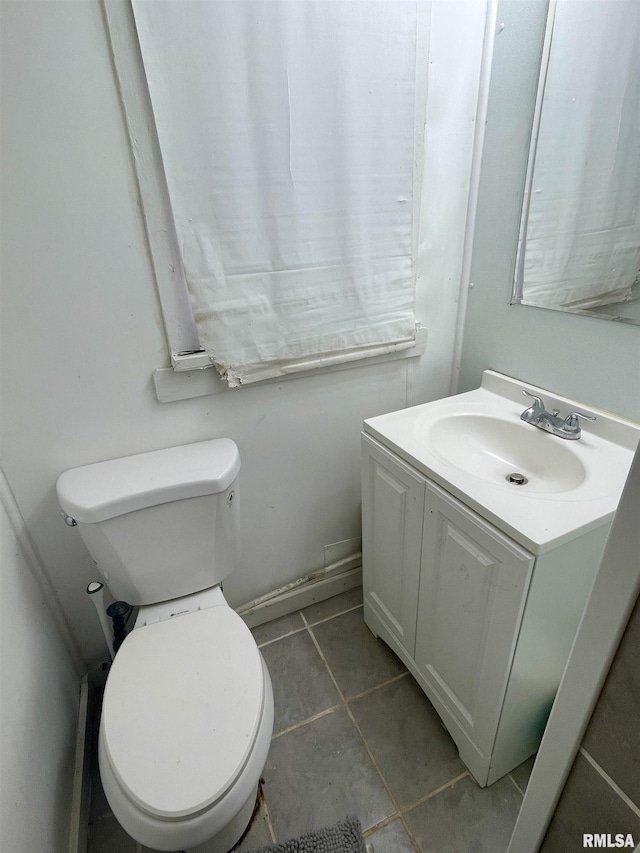 665 W Wilmot St, Chillicothe, IL 61523 - half bathroom featuring vanity, toilet, and tile patterned flooring