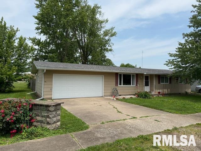 603 Sherry St, Colchester, IL 62326 - ranch-style home featuring a front yard, concrete driveway, and a garage