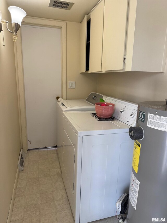 603 Sherry St, Colchester, IL 62326 - laundry area featuring water heater, independent washer and dryer, cabinet space, and baseboards