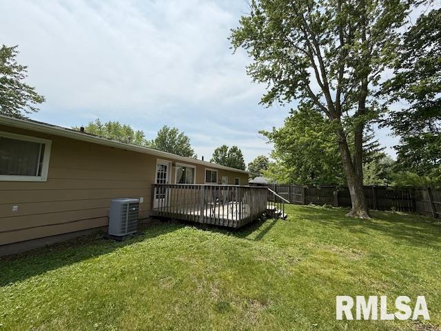 603 Sherry St, Colchester, IL 62326 - view of yard with central AC and a wooden deck