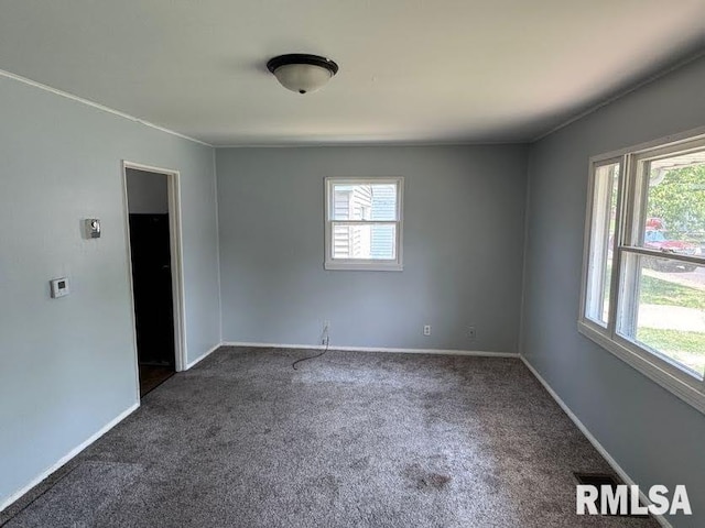 831 W Bartlett Ct, Peoria, IL 61604 - spare room with carpet floors and baseboards