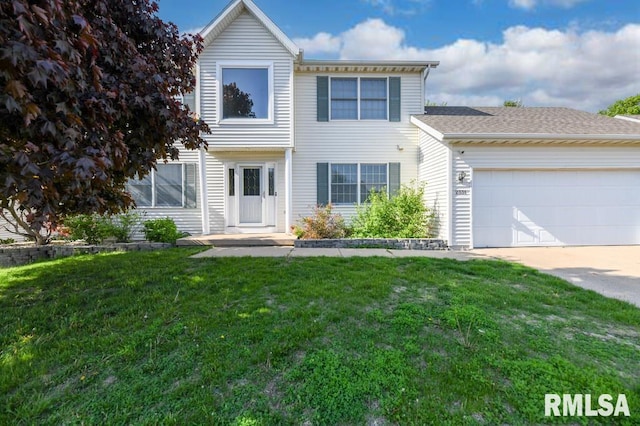 2331 W Molly Ln, Dunlap, IL 61525 - view of front of house with a garage, concrete driveway, and a front lawn