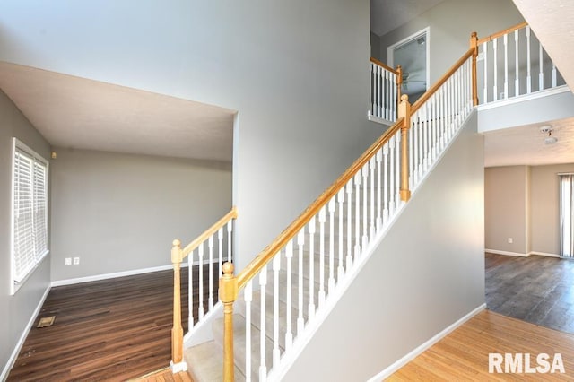 2331 W Molly Ln, Dunlap, IL 61525 - staircase with wood finished floors, baseboards, and a high ceiling
