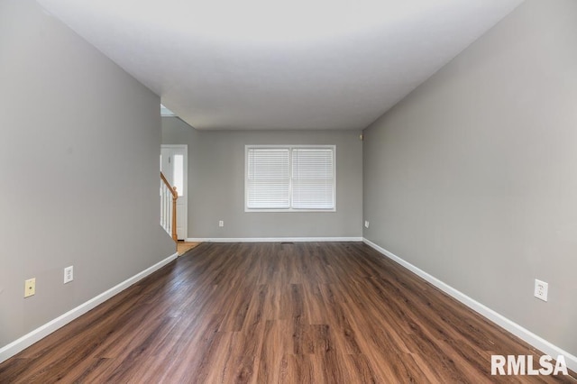 2331 W Molly Ln, Dunlap, IL 61525 - spare room with baseboards, dark wood finished floors, and stairs