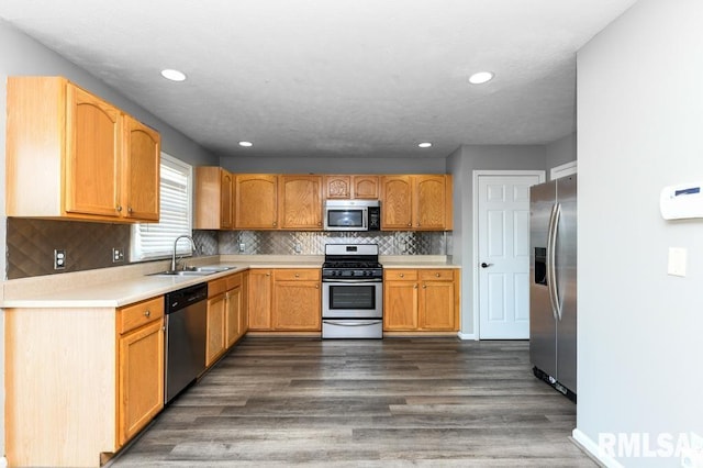 2331 W Molly Ln, Dunlap, IL 61525 - kitchen featuring stainless steel appliances, a sink, dark wood finished floors, light countertops, and recessed lighting