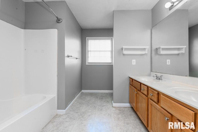2331 W Molly Ln, Dunlap, IL 61525 - full bathroom featuring double vanity, bathtub / shower combination, and baseboards
