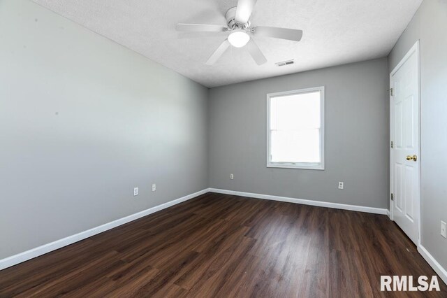 2331 W Molly Ln, Dunlap, IL 61525 - empty room featuring dark wood-type flooring, baseboards, and a ceiling fan