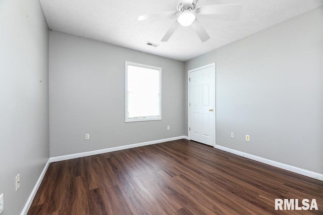 2331 W Molly Ln, Dunlap, IL 61525 - unfurnished room featuring dark wood-style floors, baseboards, and ceiling fan