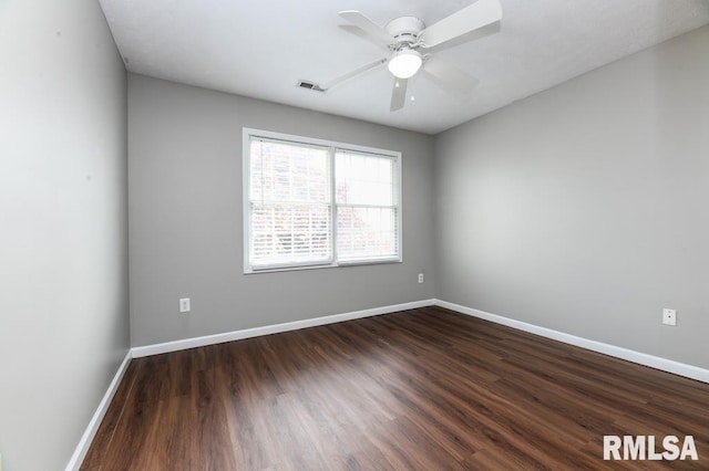 2331 W Molly Ln, Dunlap, IL 61525 - spare room featuring dark wood-type flooring, baseboards, and a ceiling fan