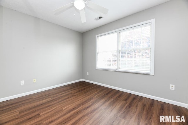 2331 W Molly Ln, Dunlap, IL 61525 - empty room featuring healthy amount of natural light, dark wood-style flooring, baseboards, and ceiling fan