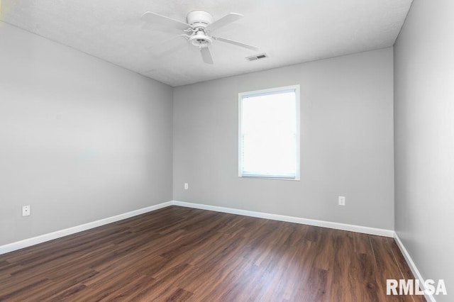 2331 W Molly Ln, Dunlap, IL 61525 - empty room with dark wood finished floors, baseboards, and ceiling fan