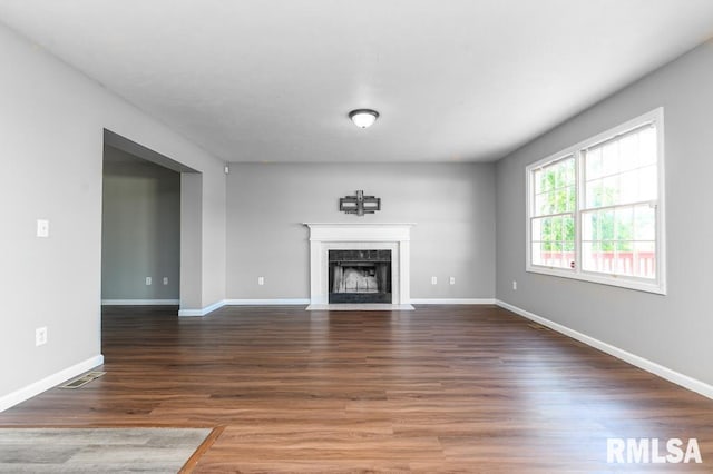 2331 W Molly Ln, Dunlap, IL 61525 - unfurnished living room with wood finished floors, baseboards, and a fireplace