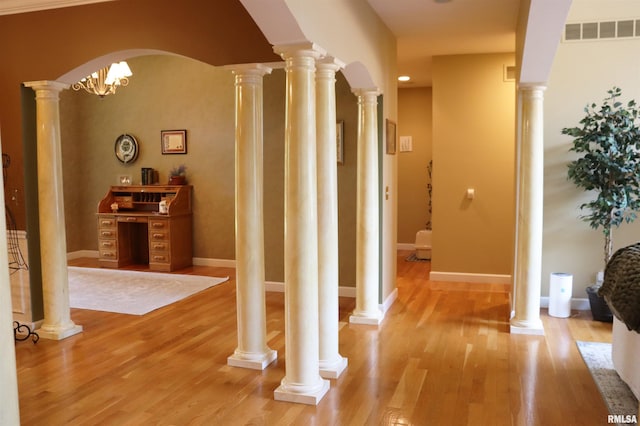 1112 W Cedar Hills Dr, Dunlap, IL 61525 - hallway with light wood-style floors, baseboards, and arched walkways