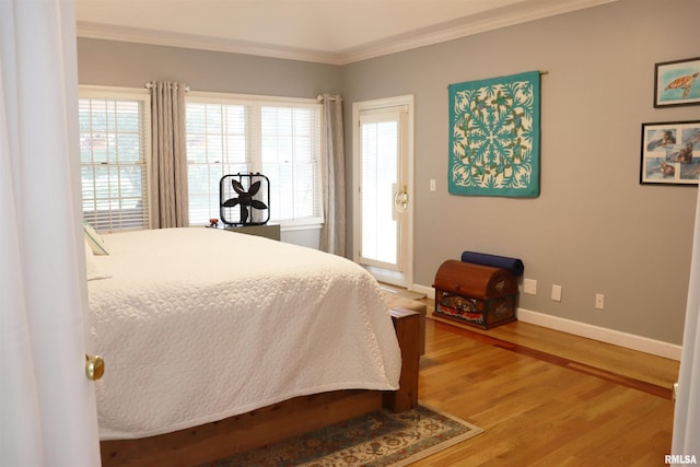 1112 W Cedar Hills Dr, Dunlap, IL 61525 - bedroom featuring wood finished floors, ornamental molding, and baseboards