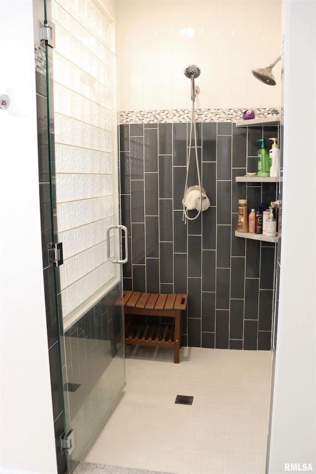 1112 W Cedar Hills Dr, Dunlap, IL 61525 - bathroom with a shower stall, tile walls, and tile patterned floors