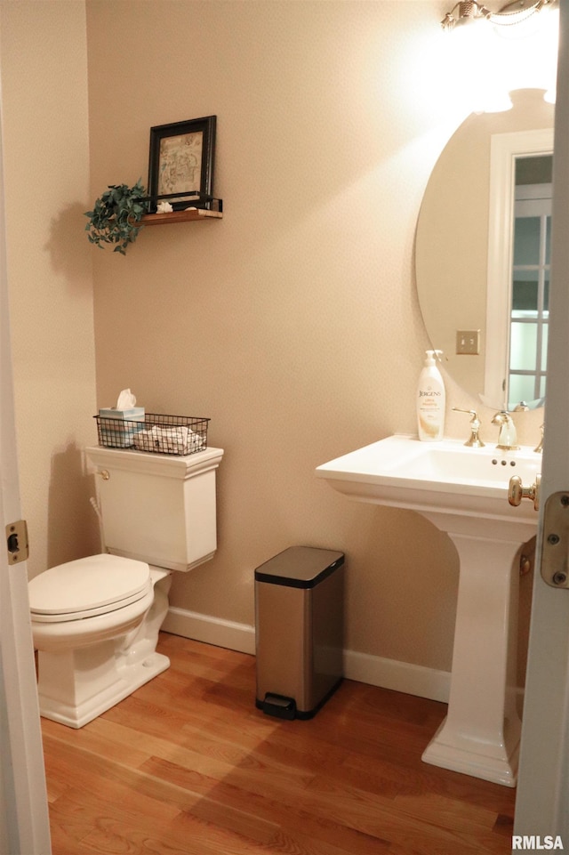 1112 W Cedar Hills Dr, Dunlap, IL 61525 - bathroom featuring toilet, wood finished floors, and baseboards