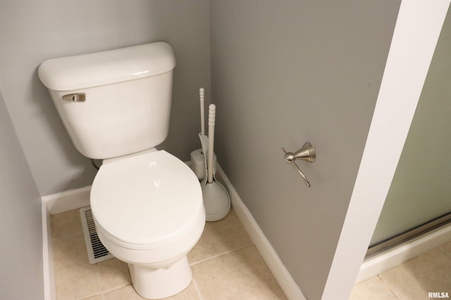 1112 W Cedar Hills Dr, Dunlap, IL 61525 - bathroom featuring toilet, baseboards, tile patterned floors, and a shower stall