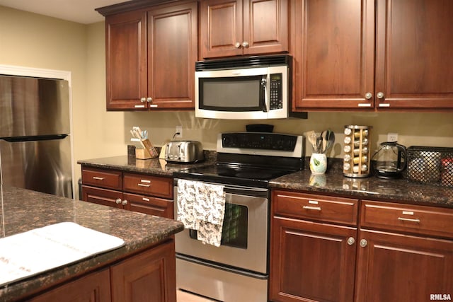 1112 W Cedar Hills Dr, Dunlap, IL 61525 - kitchen featuring appliances with stainless steel finishes and dark stone counters