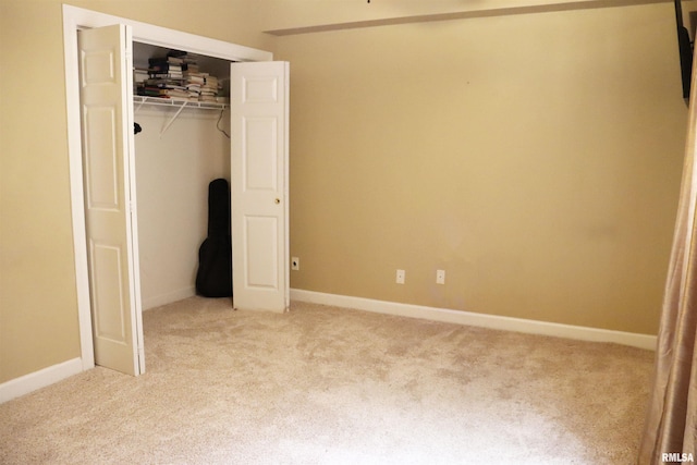 1112 W Cedar Hills Dr, Dunlap, IL 61525 - unfurnished bedroom featuring light carpet, a closet, and baseboards