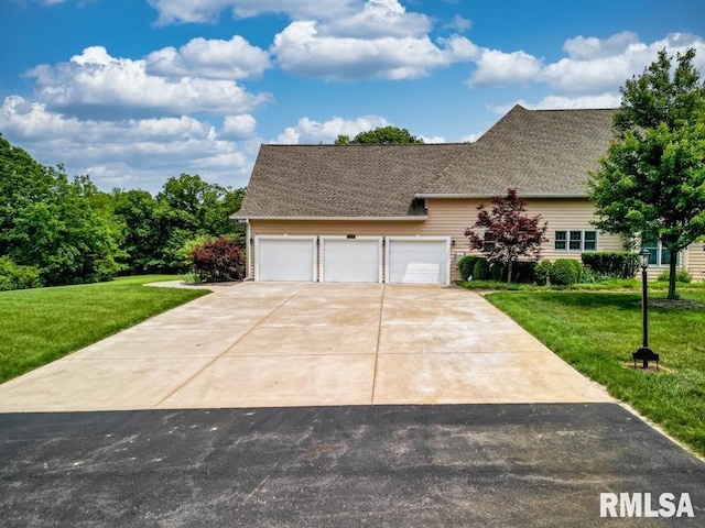 1112 W Cedar Hills Dr, Dunlap, IL 61525 - view of front of property featuring a front yard, driveway, and an attached garage
