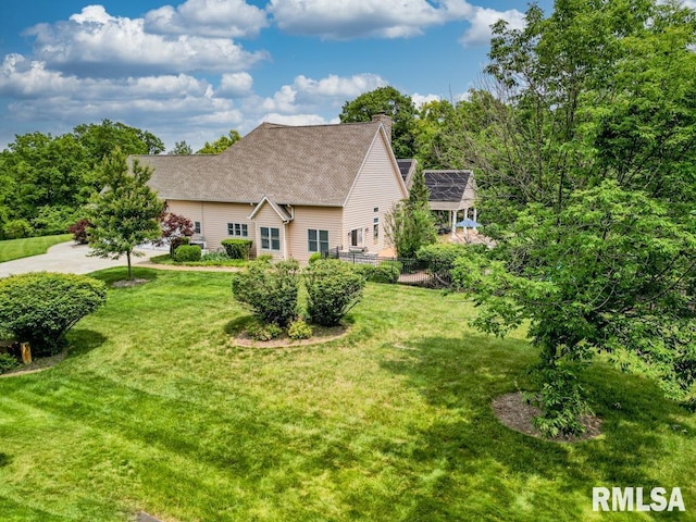 1112 W Cedar Hills Dr, Dunlap, IL 61525 - view of side of property featuring a lawn and a chimney