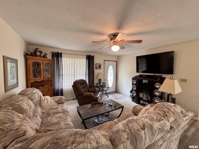 1612 Joyce Ln, Macomb, IL 61455 - living area with ceiling fan, baseboards, and a textured ceiling