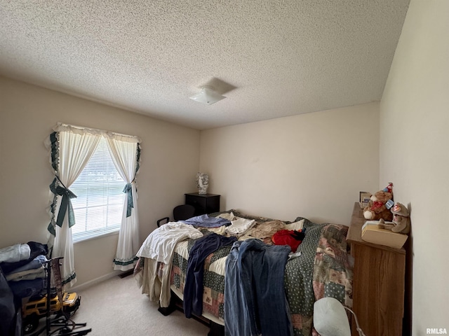 1612 Joyce Ln, Macomb, IL 61455 - bedroom featuring light carpet and a textured ceiling