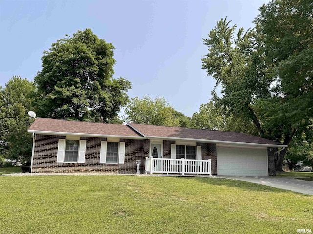1612 Joyce Ln, Macomb, IL 61455 - ranch-style home featuring brick siding, a front lawn, a garage, and a porch
