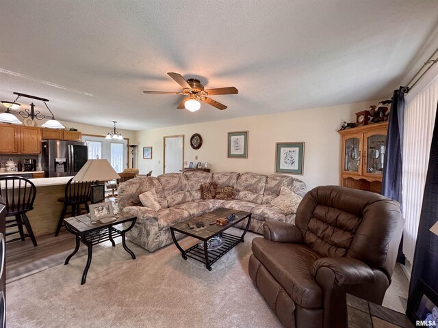 1612 Joyce Ln, Macomb, IL 61455 - living area with a ceiling fan and a textured ceiling