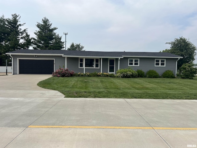 1302 Maple Ave, Macomb, IL 61455 - ranch-style home featuring an attached garage, driveway, and a front lawn