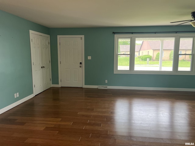 1302 Maple Ave, Macomb, IL 61455 - spare room featuring ceiling fan, wood finished floors, and baseboards