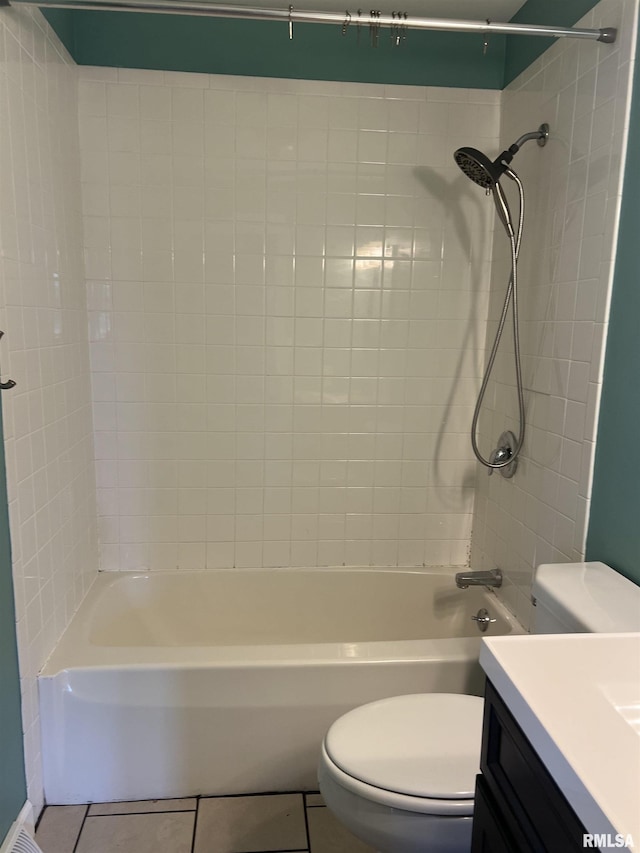 1302 Maple Ave, Macomb, IL 61455 - bathroom featuring toilet, tile patterned floors, vanity, and washtub / shower combination