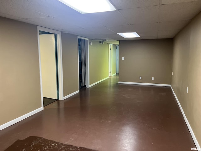 1302 Maple Ave, Macomb, IL 61455 - unfurnished room with concrete floors, a paneled ceiling, and baseboards
