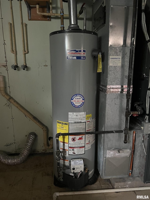 1302 Maple Ave, Macomb, IL 61455 - utility room featuring water heater and heating unit