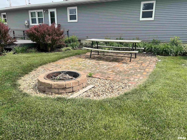 1302 Maple Ave, Macomb, IL 61455 - view of green lawn with a fire pit and a patio area