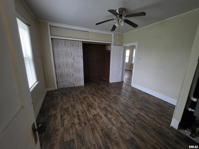 504 S Pennsylvania Ave, Abingdon, IL 61510 - unfurnished bedroom featuring ornamental molding, dark wood-type flooring, a closet, and a ceiling fan