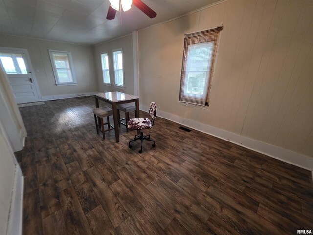 504 S Pennsylvania Ave, Abingdon, IL 61510 - unfurnished dining area featuring dark wood finished floors, ornamental molding, and ceiling fan