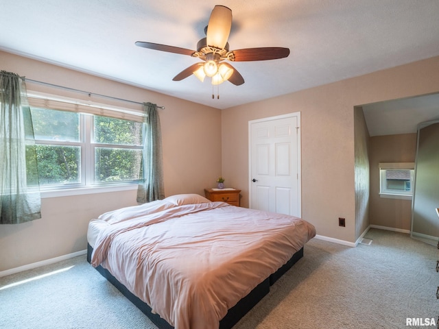 2010 E Paris Ave, Peoria, IL 61614 - bedroom featuring light carpet and a ceiling fan