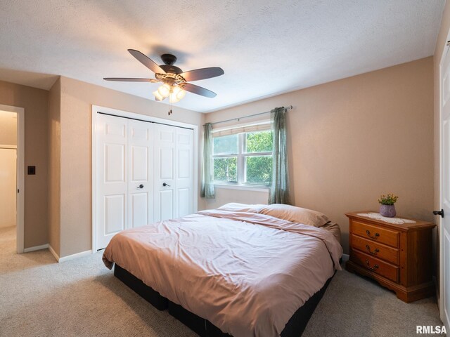 2010 E Paris Ave, Peoria, IL 61614 - bedroom featuring light colored carpet, a closet, and ceiling fan
