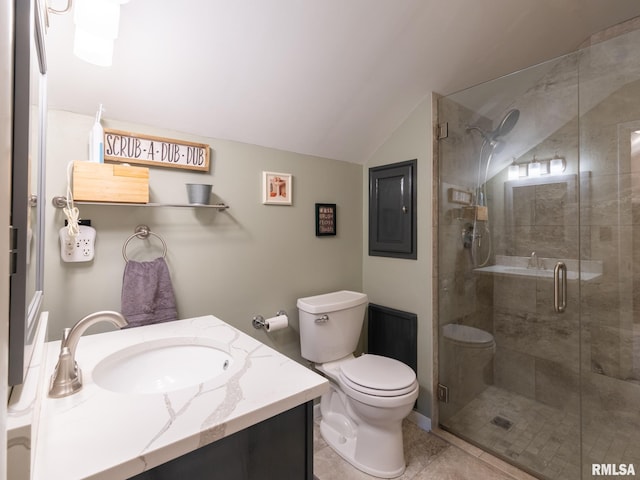 2010 E Paris Ave, Peoria, IL 61614 - bathroom with vanity, vaulted ceiling, a stall shower, and tile patterned flooring