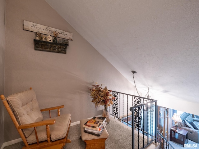 2010 E Paris Ave, Peoria, IL 61614 - living area with lofted ceiling, carpet, and a textured ceiling