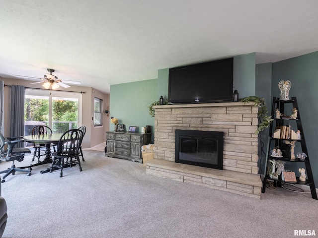 2010 E Paris Ave, Peoria, IL 61614 - living room with carpet flooring, a fireplace, and a ceiling fan